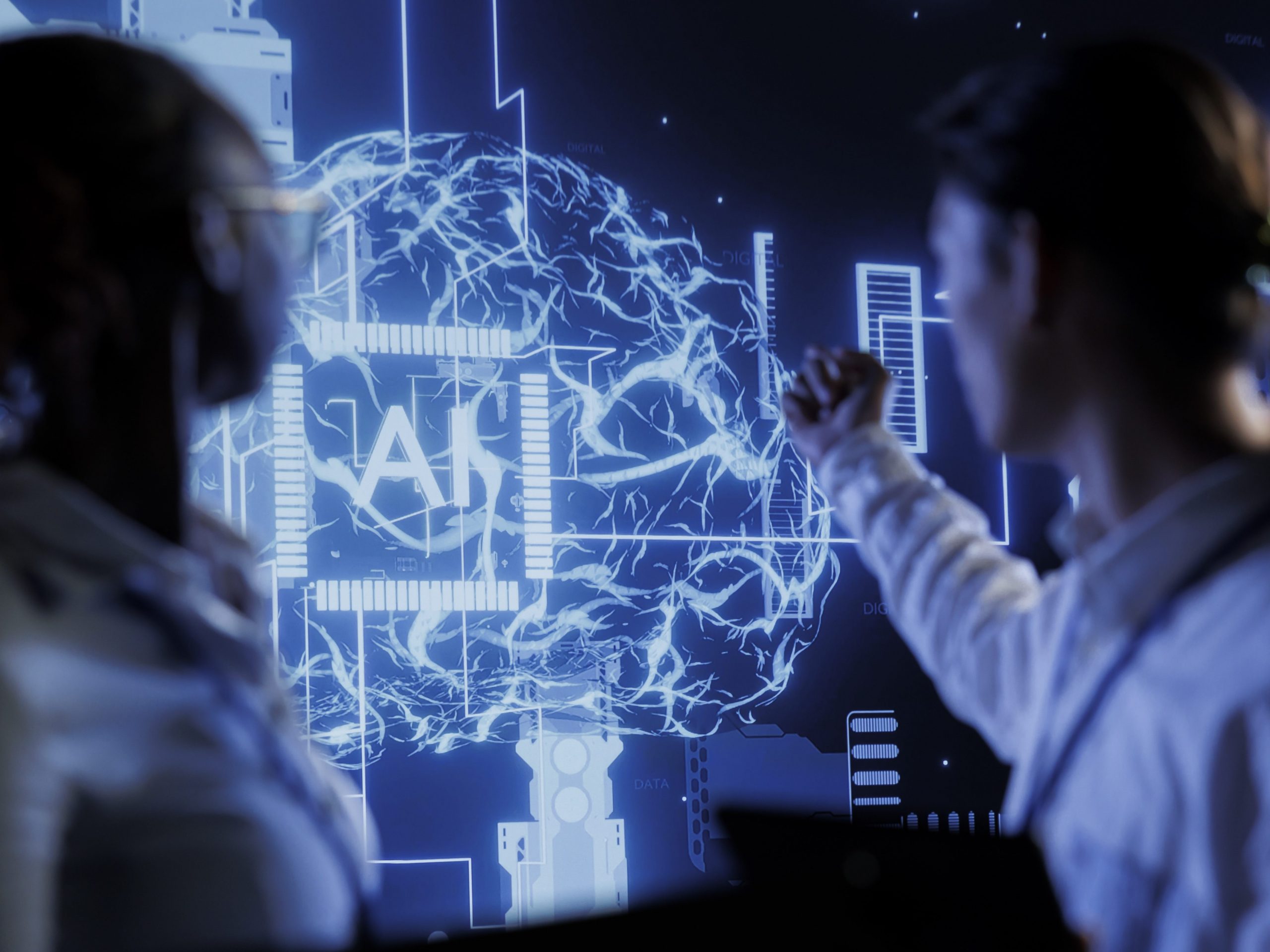 Computer scientists brainstorm ways to use AI cognitive computing to extract usable information from complex data. Data center employees implement artificial intelligence to process massive datasets